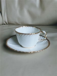 Cauldon Ware porcelain teacup and saucer embossed white porcelain with gold tone accents collectible
