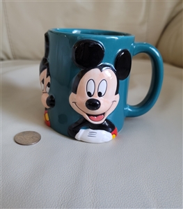 Pre-owned vintage Disney Mickey Mouse embossed teal porcelain mug for display or collection