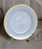 Vintage Noritake Goldridge 5480 dinner plate featuring a thick gold encrusted geometric rim on a smooth white porcelain body
