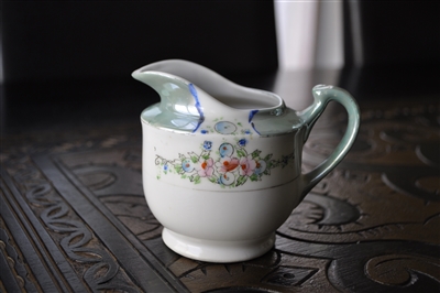 Japanese hand painted iridescent lusterware porcelain creamer pitcher with green border and pink flowers from the 1920s
