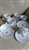 Seven piece Royal Doulton Michelle porcelain teacup and saucer set with blue floral sprays and platinum trim on cream background
