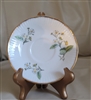 Vintage Elizabethan Staffordshire porcelain saucer with hand-painted blooming berry design, ribbed edges, and gold-tone rim