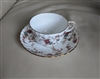 Ancestral by Minton porcelain teacup and saucer multi color florals over white porcelain