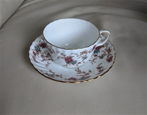 Ancestral by Minton porcelain teacup and saucer multi color florals over white porcelain