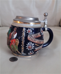 Vintage Marzi and Remy German beer stein in deep cobalt blue with embossed tavern scene and pewter lid