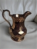 Wade English copper lustre porcelain pitcher in geometrical design.