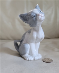 Retired vintage Lladró porcelain sitting cat figurine with pastel gray finish and upturned face showcasing fine Spanish craftsmanship