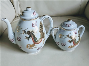 Japanese SPP dragonware porcelain tea set featuring teapot and lidded sugar bowl with raised gold moriage dragon motif