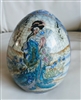 Satsuma style porcelain egg featuring hand painted Geisha holding fan with raised Moriage floral details and crackle glaze