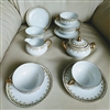 Charles Ahrenfeldt Limoges 13-piece tea service set for Gump's San Francisco with Arcs and Dots gold pattern from the 1920s