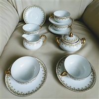 Charles Ahrenfeldt Limoges 13-piece tea service set for Gump's San Francisco with Arcs and Dots gold pattern from the 1920s
