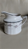 Noritake Traviata pattern fine porcelain creamer pitcher with pink floral sprays and platinum silver trim from the 1980s