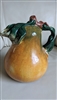 hand painted ceramic pear shaped pitcher with sculpted handle on white background