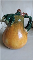 hand painted ceramic pear shaped pitcher with sculpted handle on white background