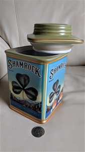 shamrock porcelain storage canister with green lid on a white surface