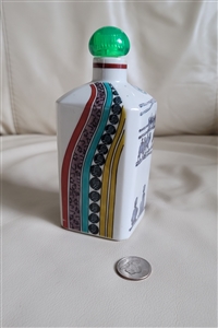 Modern Japanese ceramic sake bottle with colorful geometric and camel pattern