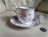 Preowned vintage Royal Albert fine bone china footed teacup and matching saucer set in the embroidered Petit Point floral needlepoint pattern