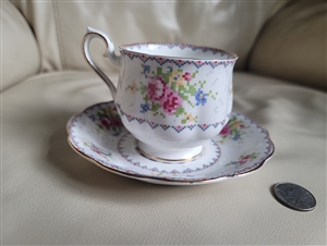 Royal Albert Petit Point fine bone china teacup and saucer set with cross-stitch floral pattern and brushed gold trim