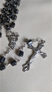 pre-owned vintage hematine tube bead rosary with silver tone crucifix