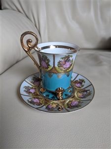 Antique STW Bavaria footed porcelain cup and saucer set with turquoise panels and romantic courting couple medallions