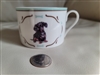 Dachshund decorated porcelain teacup with blue border and gold accents by Danbury Mint England