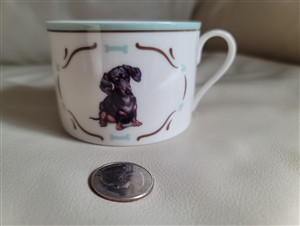 Dachshund decorated porcelain teacup with blue border and gold accents by Danbury Mint England