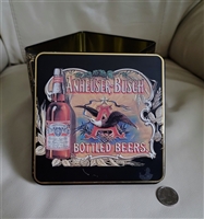 Preowned vintage Anheuser Busch Bottled Beers advertising tin container front view showing embossed eagle lid graphic