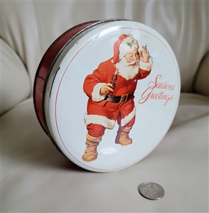 The Real Santa round tin 1979 Coca-Cola collector series showing vintage oxidation and scratches