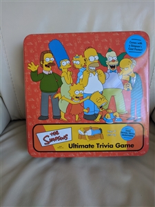 The Simpsons Ultimate Trivia Game with a tin box and poster game night accessories poster