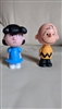 Two thousand and fifteen McDonald's Happy Meal toys featuring The Peanuts Charlie and Lucy in hard plastic
