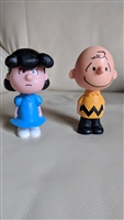 Two thousand and fifteen McDonald's Happy Meal toys featuring The Peanuts Charlie and Lucy in hard plastic