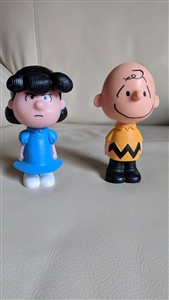 Two thousand and fifteen McDonald's Happy Meal toys featuring The Peanuts Charlie and Lucy in hard plastic