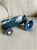 Tractor toy vintage heavy cast iron primitive industrial folk art collectible handcrafted showing weathered blue paint and tool wheels