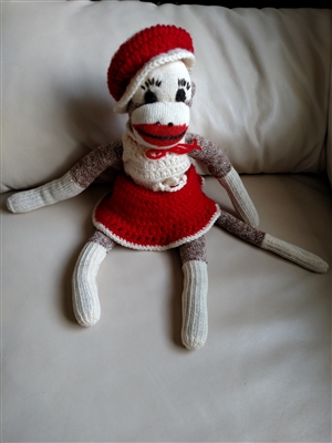 Vintage stuffed Sock Monkey in crochet dress handcrafted collectible display