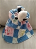 Detailed view of a vintage handmade Black Americana doll featuring a wide flared patchwork skirt and a faceless head design with a primitive tignon wrap